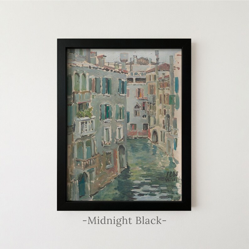 May include: A framed oil painting depicting a canal scene in Venice with multi-story buildings in shades of grey, blue, and tan. The artwork features visible brushstrokes, a water-filled canal, and the text 1888 in the lower right corner.
