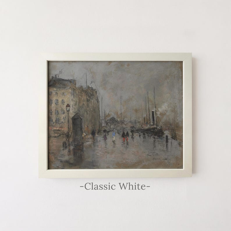 May include: A framed oil painting in a classic white frame depicting a rainy city street scene with muted brown and gray tones. The artwork features tall buildings, a street lamp, and figures walking along a wet path, with the text -Classic White- below.