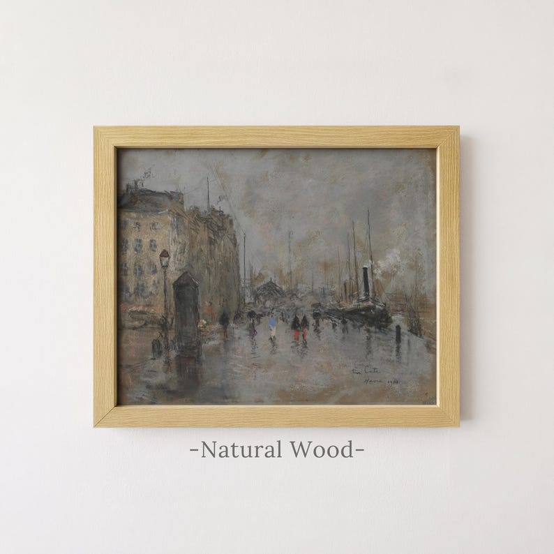 May include: A framed painting in a light natural wood frame depicting a rainy harbor scene with muted gray and brown tones. The artwork shows buildings, ships, and small figures walking along a wet quay. The signature and date 1922 are visible.
