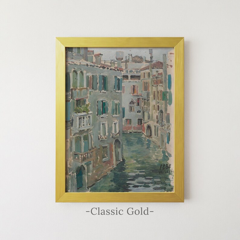 May include: A framed oil painting depicting a Venetian canal scene with multi-story buildings in shades of grey, blue, and terracotta, featuring the date 1888 in the lower right corner, enclosed in a rectangular classic gold-colored metal frame.