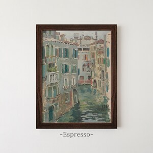 May include: A framed oil painting depicting a canal scene in Venice with multi-story buildings featuring teal shutters and balconies. The water reflects the architecture in muted tones of blue, green, and grey. The painting is dated 1888 in the corner.