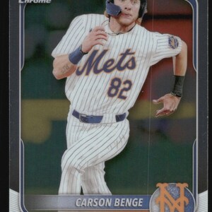 May include: Baseball card featuring Carson Benge of the New York Mets. The card has a chrome finish and shows Benge in a Mets uniform with the number 82. The card has a blue and orange Mets logo.