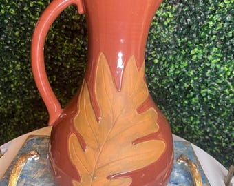 clat pottery pitcher with oak leaf design