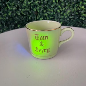 Uranium glaze- vintage Hall Pottery Tom & Jerry mug. 1930s-40s.