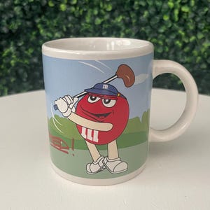 2003 MandM&#39;s coffee mug featuring the Yellow M&M character in a baseball-themed design.