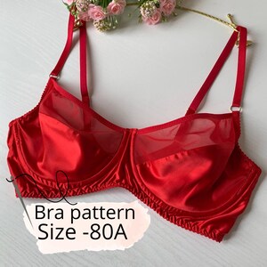 May include: A red satin bra with sheer mesh panels. The bra has adjustable straps and a classic design. Text on the image reads "Bra pattern Size -80A".