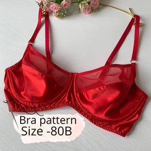 May include: A red satin bra with sheer mesh panels and adjustable straps. The bra features a classic design with underwire support. Text on the image reads "Bra pattern Size -80B".
