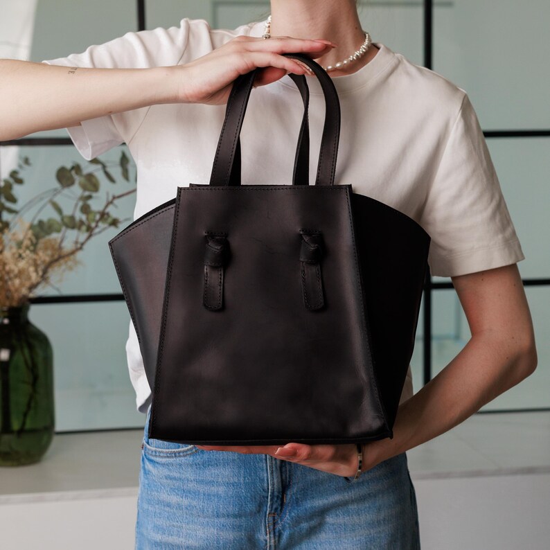 Elevate your everyday with our Leather Shoulder Tote Bag. Expertly handmade from premium leather, this minimalist leather tote bag is perfect for work, errands, or casual outings. Spacious, stylish, and strong — use it as a leather work tote bag or large leather shoulder bag.