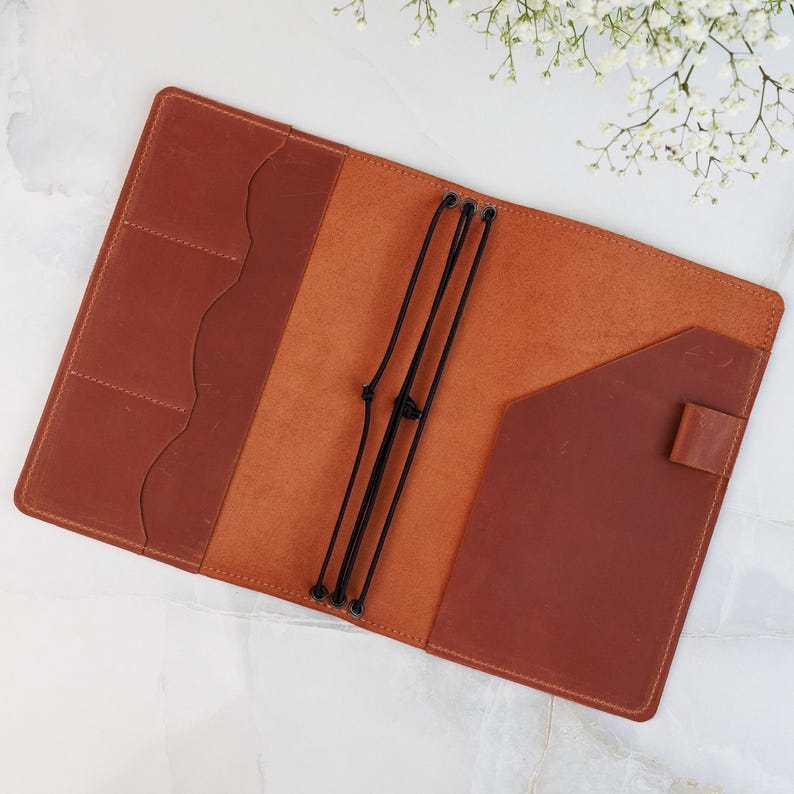 Capture your thoughts in style with our Engraved Leather Notebook Cover. Crafted from premium leather and handmade with care, it’s refillable, durable, and ideal as a personalized journal cover, leather notebook case, or travel journal. Add custom engraving for a unique touch