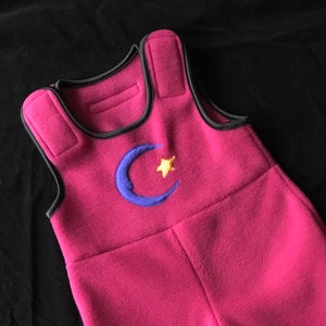 New Moon - A Magenta fleece Bubble (overall/romper) with appliquéd moon and star. Zip diaper access and adjustable hook & loop straps.