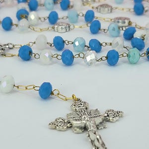 Handmade Catholic rosary with blue and white crystal prayer beads