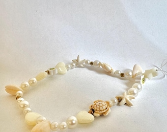 Charm pour téléphone plage de sable