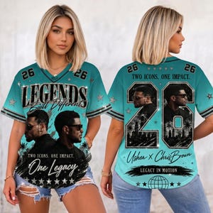 May include: A teal V-neck jersey featuring the text "LEGENDS Built Different" and "One Legacy" with portraits of two men wearing sunglasses. The back displays the number "26", the text "TWO ICONS. ONE IMPACT.", "Usher X Chris Brown", and "LEGACY IN MOTION".