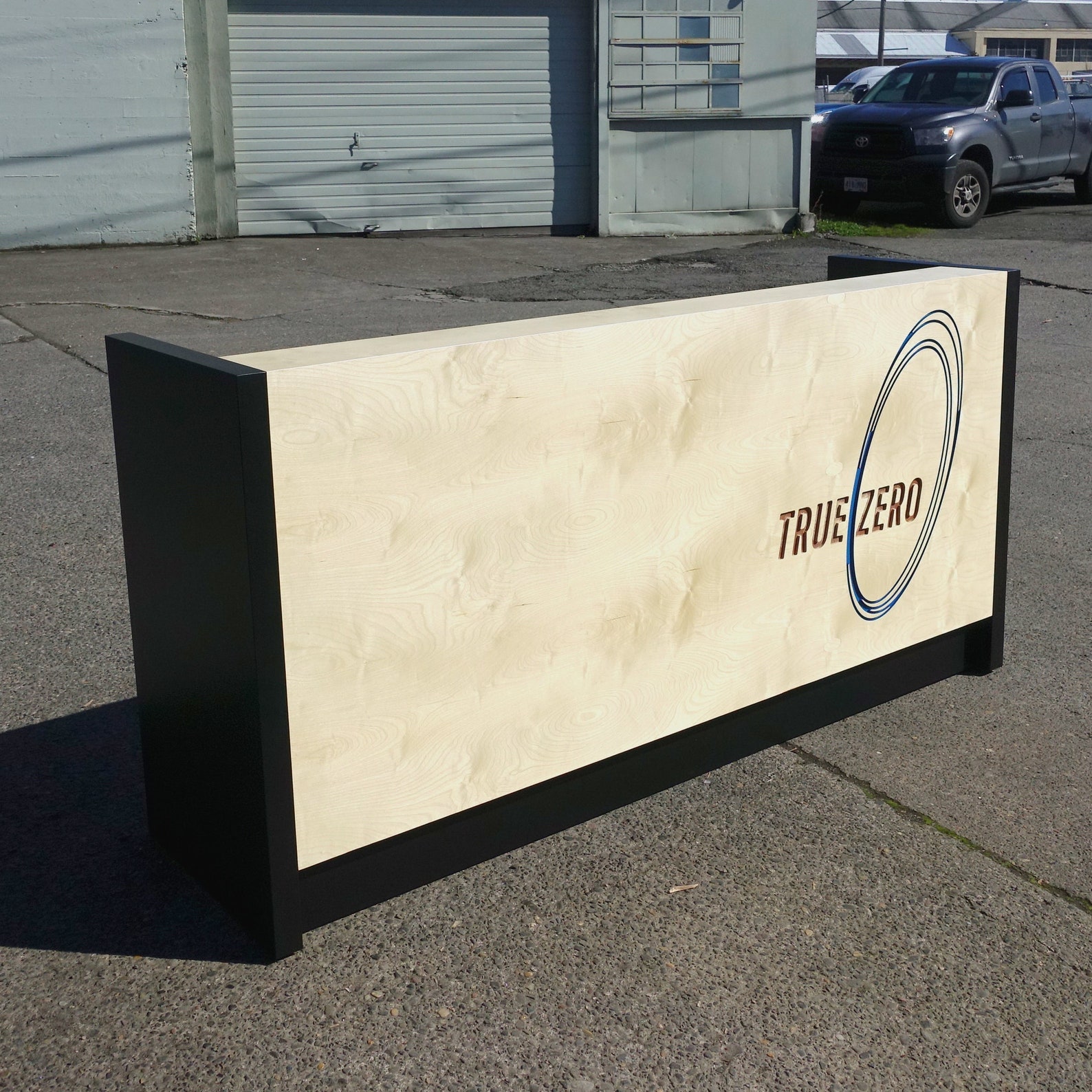 Basic Birch Plywood Reception Desk With Carved Logo Split Finish Colored Light Toe Kick and FREE