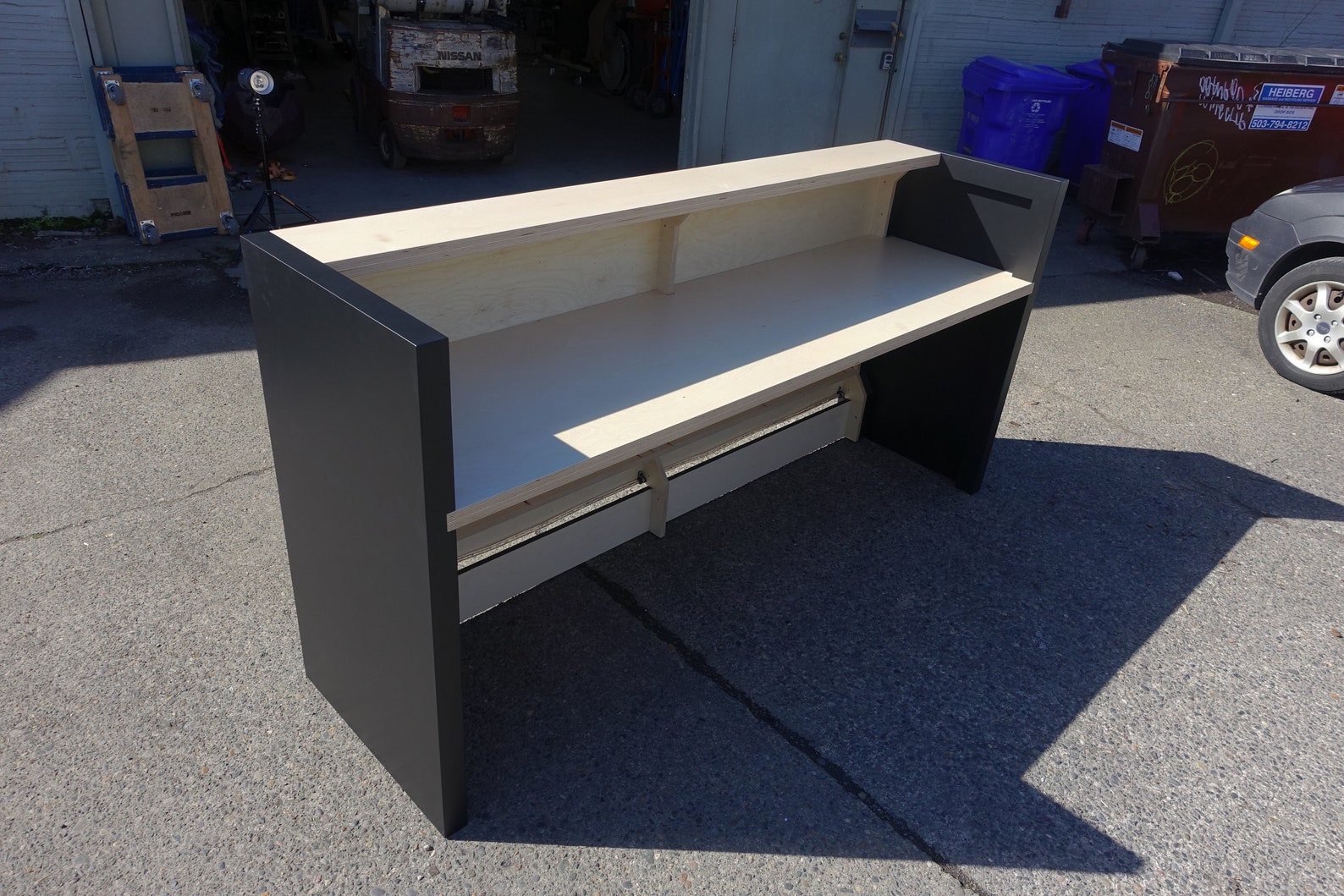 Basic Birch Plywood Reception Desk With Carved Logo Split Finish Colored Light Toe Kick and FREE