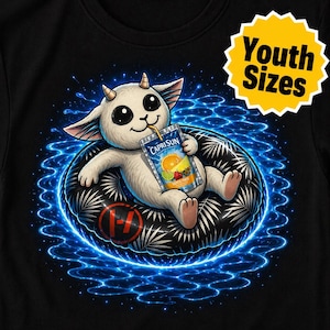 May include: Black t-shirt featuring a cartoon creature with horns, holding a Capri Sun drink. The creature is floating on a black inner tube with a palm leaf design, surrounded by blue energy waves. Text on the shirt reads "Youth Sizes."