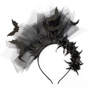 May include: A black Halloween headband featuring bat silhouettes, black roses, and a tulle veil. The headband has a curved design with a black base and is suitable for costume parties or themed events.