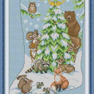 May include: Cross-stitch design featuring a Christmas stocking filled with woodland animals. The scene includes a Christmas tree, owl, bear, deer, fox, raccoon, squirrel, and rabbits, all set against a snowy blue background. The design is framed in a blue border.