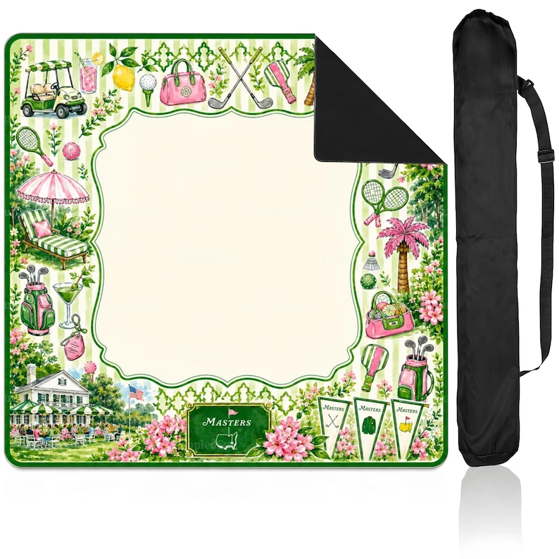 May include: A square outdoor blanket with a cream center and a green and white striped border featuring watercolor illustrations of golf carts, clubs, bags, pink flowers, and a clubhouse. Includes a black carrying bag with a shoulder strap.