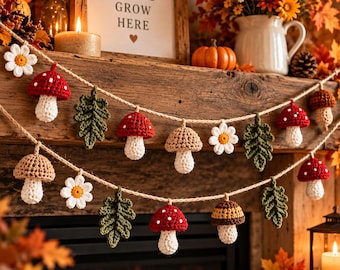 May include: A decorative garland featuring crocheted elements including red and white spotted mushrooms, brown mushrooms, white daisies with yellow centres, and green oak leaves, all strung together on a natural tan jute twine cord.