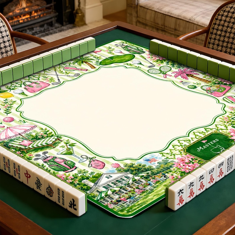May include: A square mahjong mat featuring a cream-colored center with a green border decorated with golf-themed illustrations, including golf bags, clubs, and a clubhouse. The mat is surrounded by green mahjong tiles with black characters.