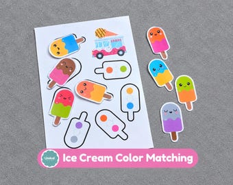 May include: A white sheet featuring colorful ice cream themed stickers and outlines for a matching activity, including a small ice cream truck graphic. Several individual die-cut ice cream bar stickers with smiling faces are placed to the right.