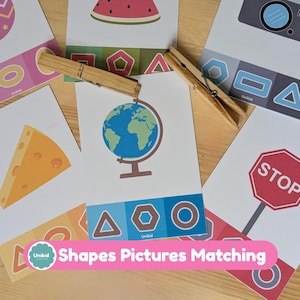 May include: A collection of educational flashcards featuring various shapes and pictures, including a globe, cheese, and a stop sign. The cards are held together with wooden clothespins. The text "Shapes Pictures Matching" is displayed on a pink banner.