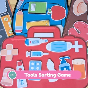 May include: A children's sorting game featuring a red first aid kit with medical tools, a blue backpack with school supplies, and a brown board with summer items. The game is labeled "Tools Sorting Game".