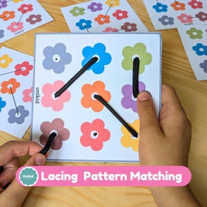May include: A children's lacing game featuring flower shapes in multiple colours. The game includes a square board with flowers and black laces, plus matching cards. The text "Lacing Pattern Matching" is visible.