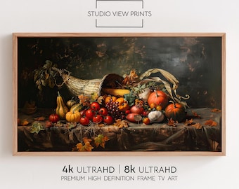 May include: A framed print featuring a still life of a cornucopia overflowing with autumn harvest produce. The image includes pumpkins, tomatoes, grapes, and corn. The text "STUDIO VIEW PRINTS" and "4K ULTRAHD | 8K ULTRAHD" are visible.