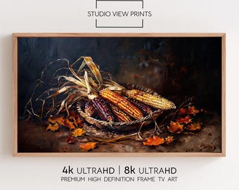May include: A framed artwork featuring a still life of colorful corn cobs in a woven basket, surrounded by dried leaves. The artwork is in a wooden frame. The text "STUDIO VIEW PRINTS" and "4K ULTRAHD | 8K ULTRAHD" are visible.