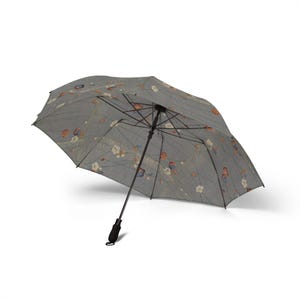 May include: Gray floral-patterned umbrella with a black handle and frame. The umbrella's canopy features a repeating pattern of flowers in shades of orange, blue, and white. The umbrella is open, showcasing its design and structure.