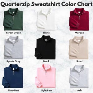 May include: A Quarterzip Sweatshirt Color Chart displaying nine long-sleeve sweatshirts with zippers in forest green, white, maroon, sports grey, black, sand, navy blue, light pink, and ash. Each sweatshirt is labeled with its respective color name.