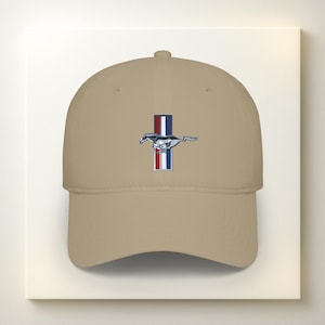 May include: Tan baseball cap featuring a vertical stripe design with red, white, and blue colors, and a silver running horse emblem. The cap has a curved brim and a structured crown.
