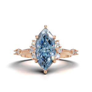 Pierścionek zaręczynowy z moissanitem w kolorze Marquise Blue: 14-karatowe żółte złoto w stylu art déco