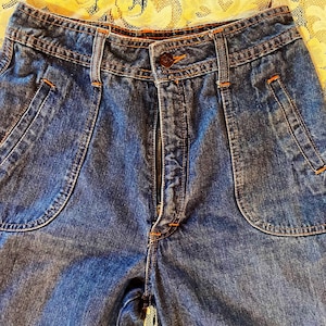 Jeans vintage dos anos 70 da Rosehips, flares com debrum laranja
