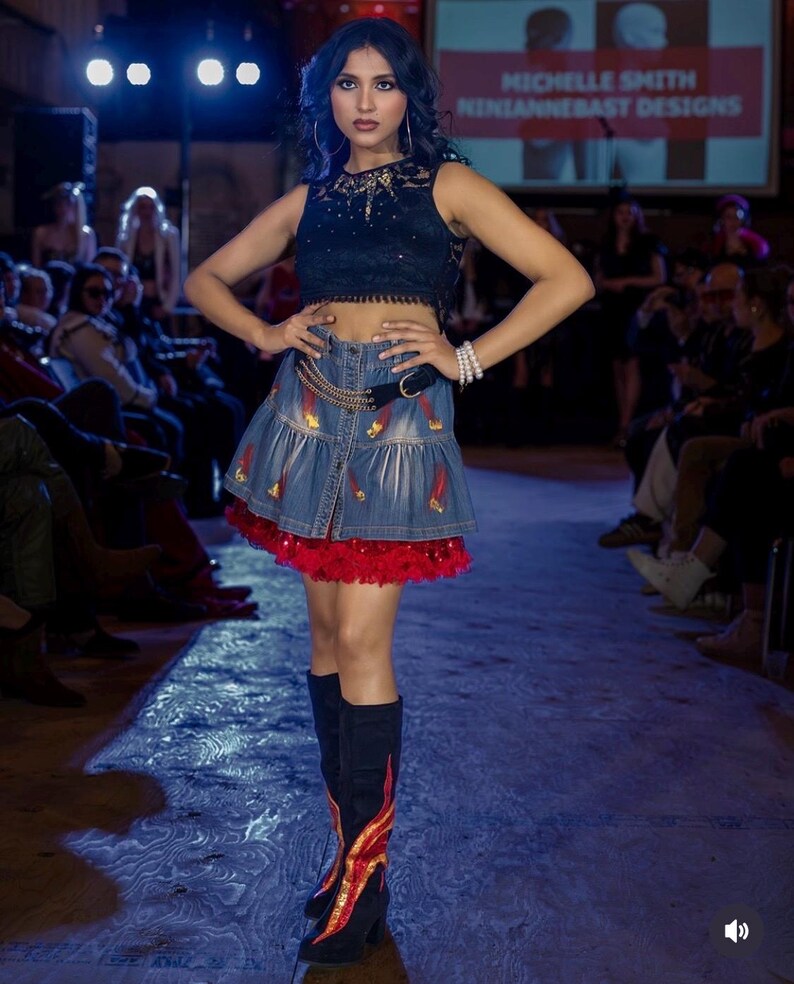 Photo showing Fireball Flame Boots worn on the runway at Hamilton Fashion Week 2026 by model lifeofnathalia (Instagram). Photo by VBR_Films (Instagram)