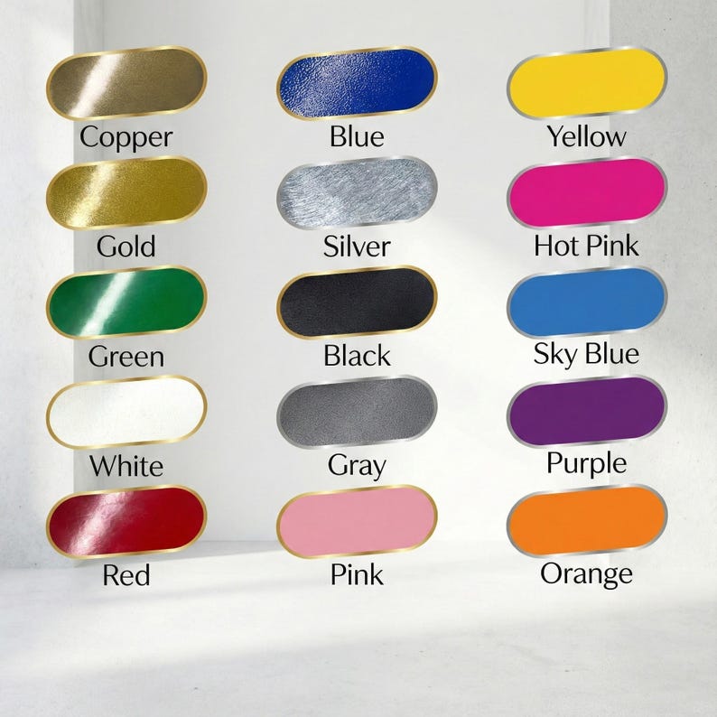 May include: A selection of oval cabinet knobs in a range of colours: copper, gold, green, white, red, blue, silver, black, grey, pink, yellow, hot pink, sky blue, purple, and orange. Each knob has a gold trim.