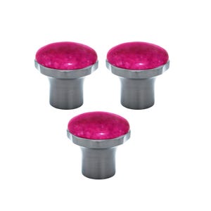 May include: Three cabinet knobs with a bright pink, rounded top and a brushed silver base. The knobs have a modern design and are set against a white background. These knobs are suitable for drawers and cabinets.