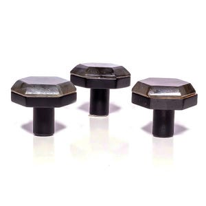 May include: Three cabinet knobs with an octagonal, smoky-grey top and a metallic border, set on a black, cylindrical base. The knobs are displayed against a white background. Each knob measures approximately 3 cm in height, offering a modern design.