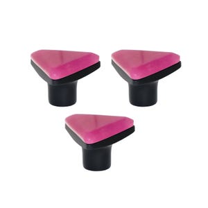 May include: Three cabinet knobs with a triangular design. Each knob has a glossy pink top, a black border, and a black cylindrical base. The knobs are arranged in a triangular pattern against a white background.