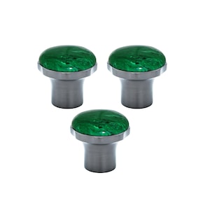 May include: Three cabinet knobs with a brushed metal base and a rounded, marbled green top. The knobs are evenly spaced against a white background, showcasing their design and texture. These knobs are suitable for furniture or cabinet upgrades.