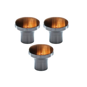 May include: Three cabinet knobs with a brushed metal base and a domed, oval top. The top has a tiger's eye appearance, with bands of brown and gold. The knobs are set against a white background.