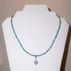 Teal green beaded necklace with heart charm