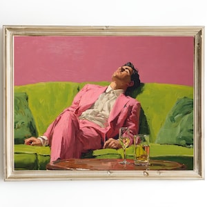 May include: A framed painting shows a person in a pink suit relaxing on a green sofa against a pink backdrop. Two glasses sit on a small table. The artwork is in a vintage, impressionistic style.