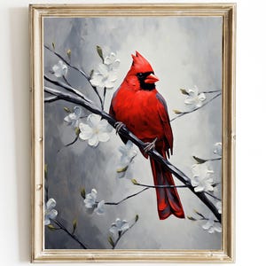 May include: A framed painting of a vibrant red cardinal bird perched on a branch with white blossoms. The artwork features a textured, impressionistic style with a gray and white background.