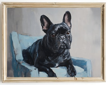 May include: A framed painting of a black French Bulldog resting on a light blue chair. The dog has a shiny black coat and is looking directly at the viewer. The painting has a gold-colored frame and is set against a gray background.