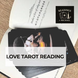 May include: A stack of tarot cards with a black and white image, featuring a person. The text "LOVE TAROT READING" is overlaid on the cards. The image also includes a book and a logo that says "READINGS BY MICHAEL".