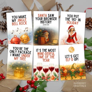May include: A collection of six Christmas-themed greeting cards with humorous phrases. The cards feature festive illustrations of jingle bells, Santa Claus, wine glasses, and elves. Text includes "You Make My Jingle Bell Rock" and "Santa Saw Your Browser History."