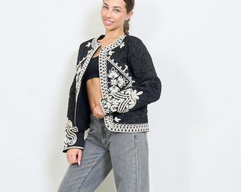 Quilted open front jacket with baroque floral triangle embroldery and rope trim
